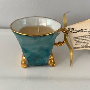 hand-painted teacup candle accented with 22k gold.